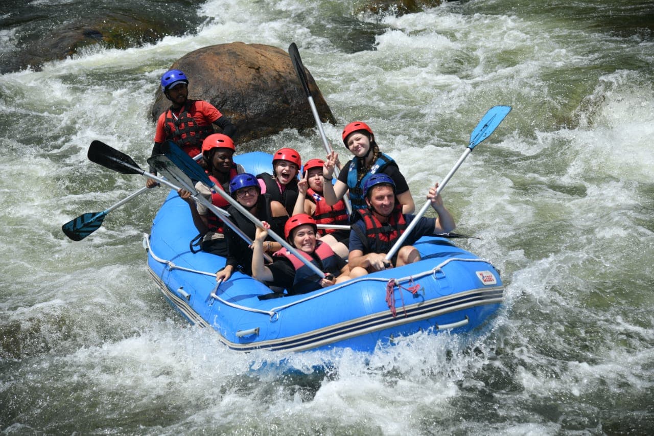 Excited rafters paddling together down the Kelani River stretch
