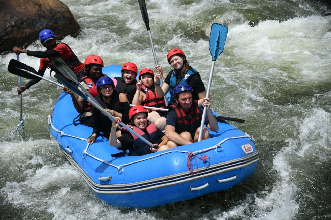 Action shot of rafters navigating Kelani river white water
