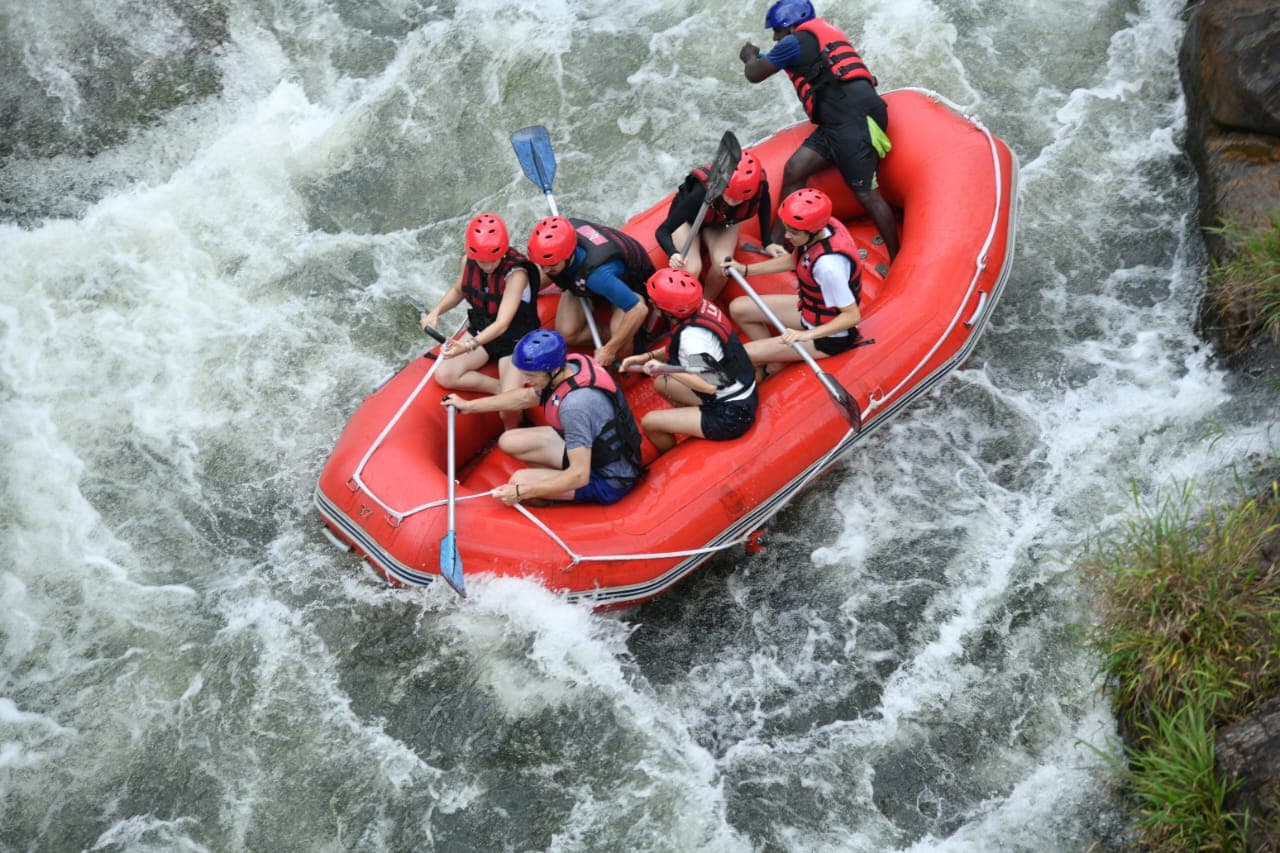 Raft crew navigating major Grade 3 rapids on the Kelani River, Kithulgala