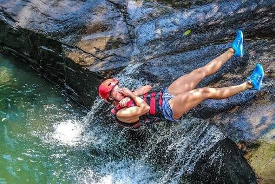 Navigating deep rock pools between waterfall drops